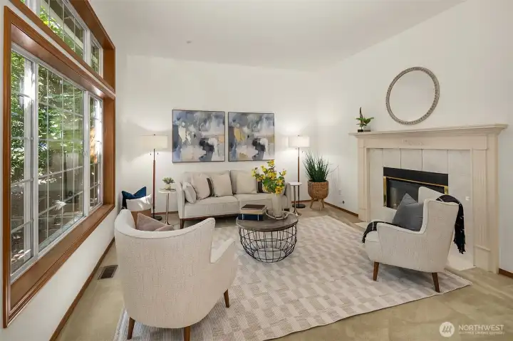 Light-filled front living area with ten foot ceiling looks out onto the front yard greenery. Light-filled front living area with ten foot ceiling looks out onto the front yard greenery.