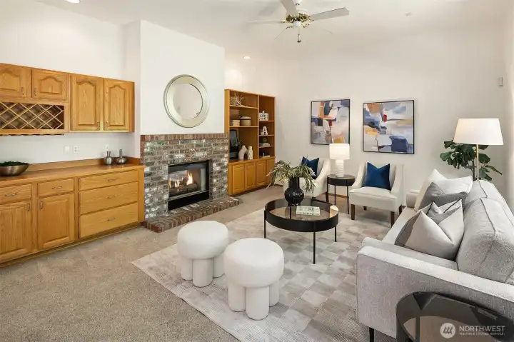 Cozy gas fireplace and beautiful built-in shelving and cabinetry. Cozy gas fireplace and beautiful built-in shelving and cabinetry.