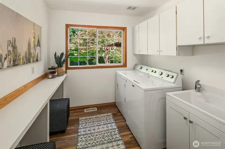 Large laundry room is just off the kitchen. Plenty of room to add more storage! Large laundry room is just off the kitchen. Plenty of room to add more storage!
