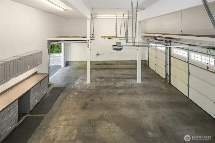Just off the laundry is the access to this 820 s.f. 3-car garage with over-height ceilings and loft storage. Just off the laundry is the access to this 820 s.f. 3-car garage with over-height ceilings and loft storage.