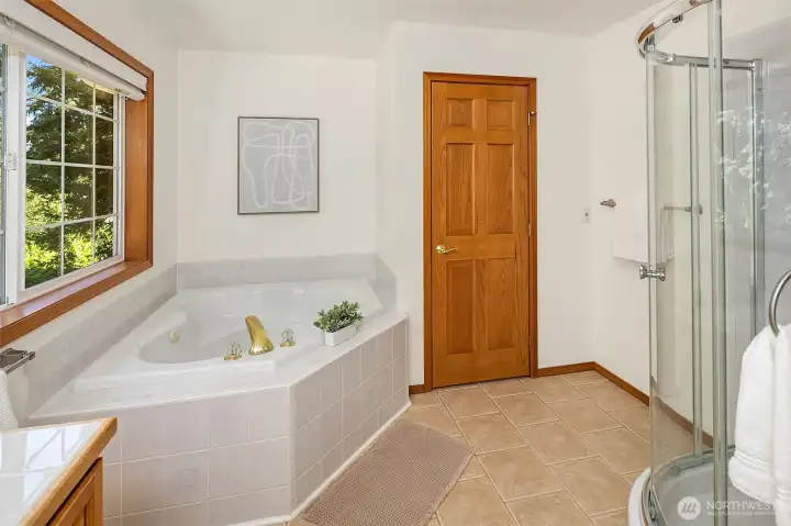 Large en suite primary bath with shower, soaking tub and water closet. Large en suite primary bath with shower, soaking tub and water closet.