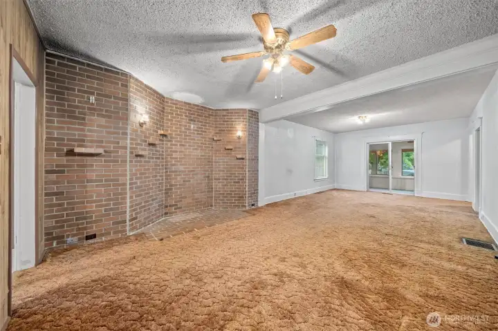 Family room connected to living room. Behind the brick wall is a large bay window Family room connected to living room. Behind the brick wall is a large bay window