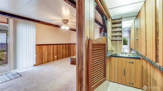Showing family room and wet bar or could convert to something else