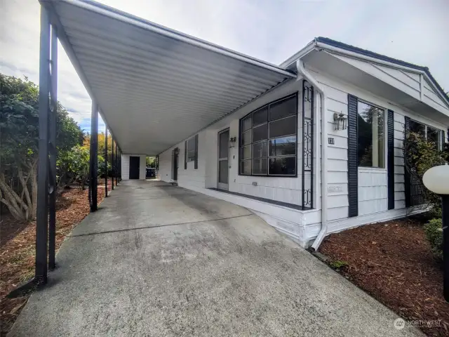 Long carport with storage at the far end