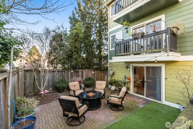 Back yard with planting area and level garden space.