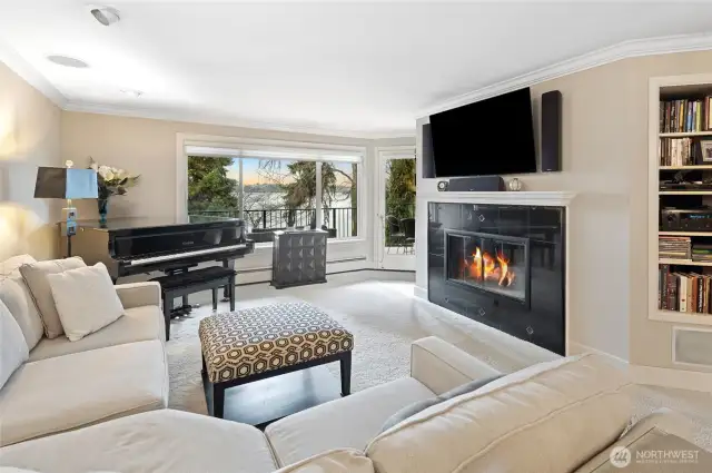 Spacious living room, with deck access, built-ins & views!