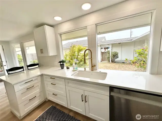 Beautiful light and bright kitchen with extra-large windows looking into the courtyard