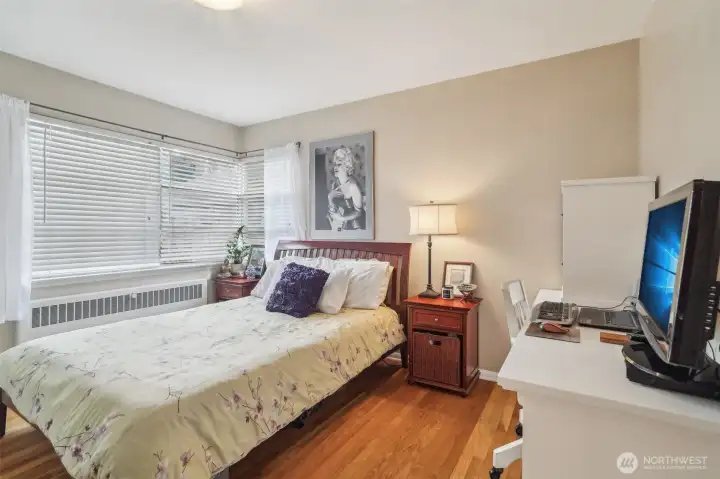 Bedroom offers space for a desk/dresser and has a large closet