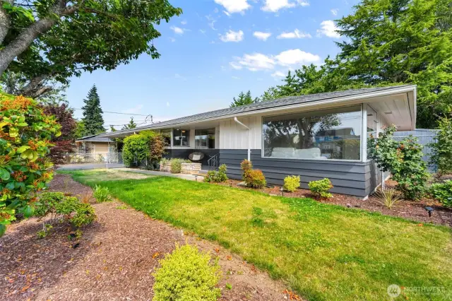 Mature landscaping surrounds the home—beautiful and low-maintenance.