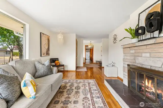 Original wood-burning fireplace anchors the living room with vintage character.