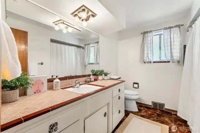 Original vintage tile adds a pop of retro charm.