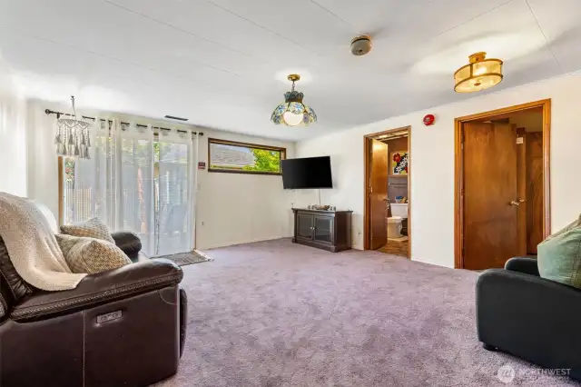 Enclosed former garage now serves as a generous family or bonus room.