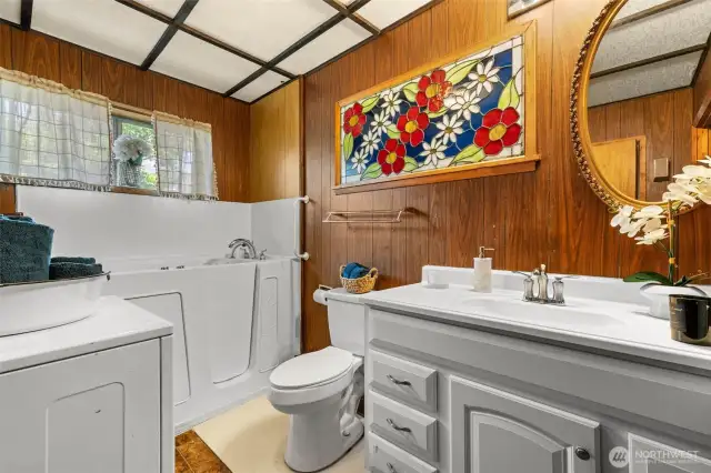 Bathroom with walk-in bathtub.