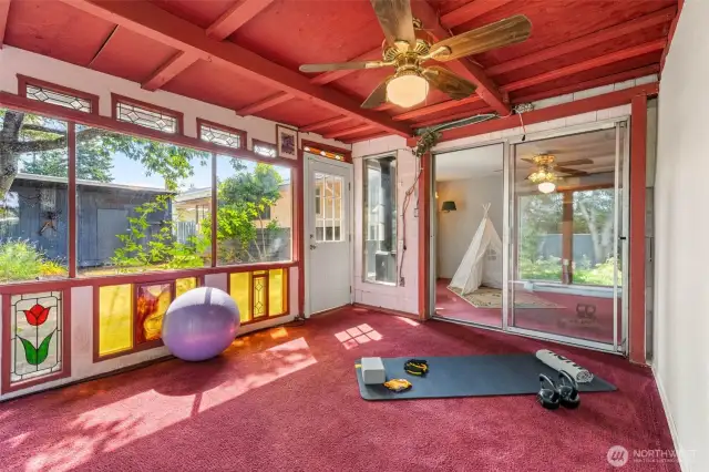 Flooded with natural light, this solarium blends warmth and versatility.