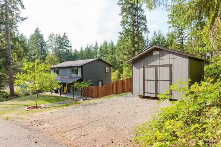 Ample parking and great curb appeal with detached shed for storage.
