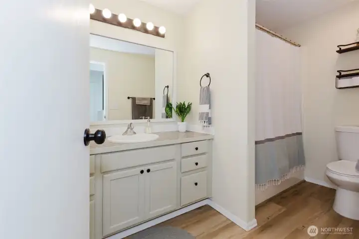 Guest bath with modern vanity and fixtures.