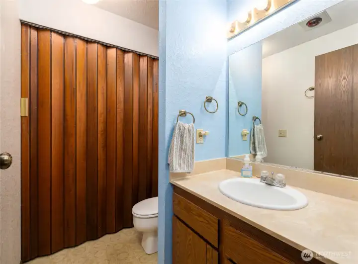 Half bath on main level with utility closet and washer/dryer