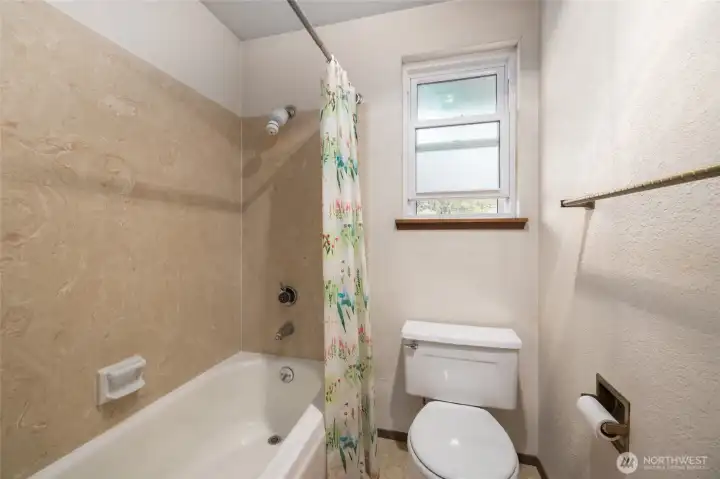 Upper level full bath opens to extra storage room (see floorplan)