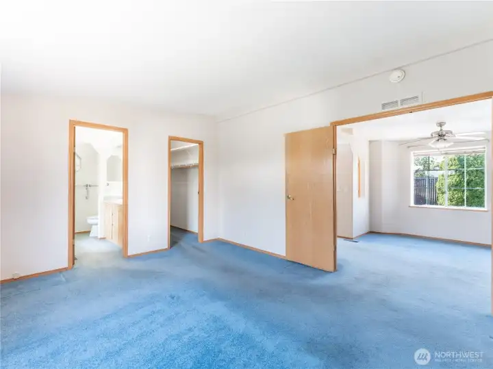 Primary Bedroom with Full Bath, Walk-In Closet and Garage Access.