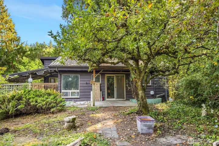 Main cabin has 1 bed, 1 bath, den-office. Newer windows, roof and wood stove.