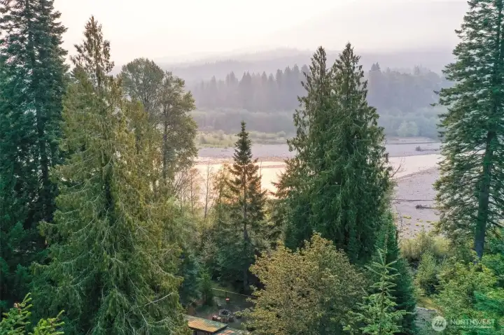 The cabin is tucked in the trees for privacy, but steps to your river access.