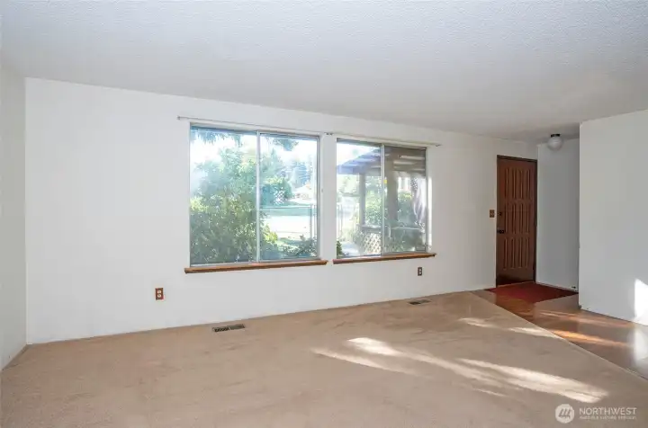 Step into this home and enjoy the large picture windows overlooking the fully fenced yard.