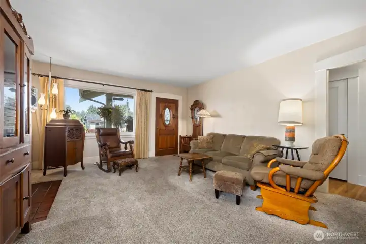 Another view of the large living room with the hallway to the beds and bath beyond.