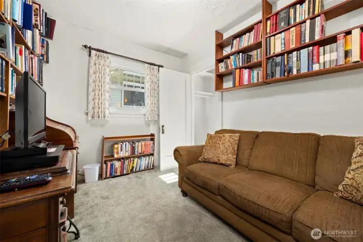The 2nd main floor bedroom was turned into a TV room as there was a stairway added to the closet that leads upstairs.
