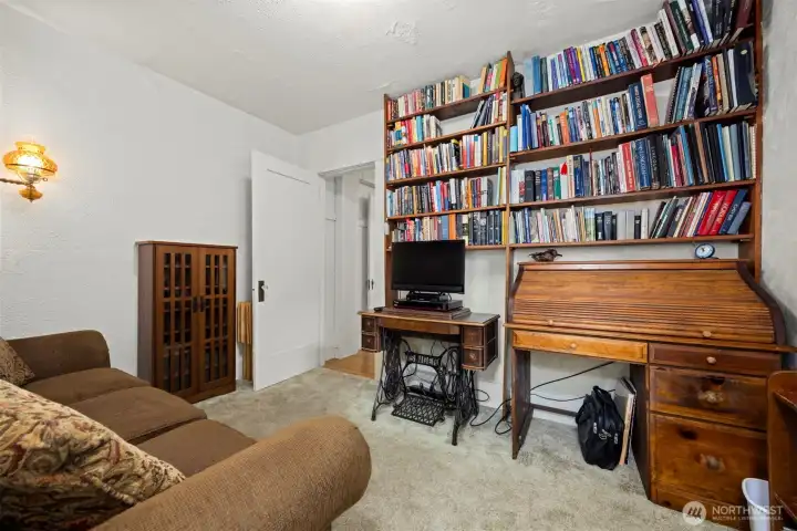 Another view of the TV room with all the built-in book shelves.