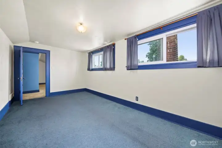 Looking toward the front room upstairs from the true bedroom.