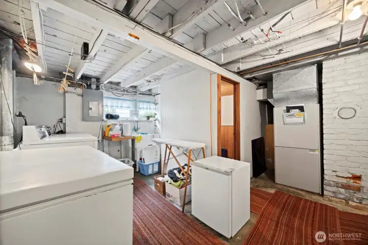 The laundry room is in the basement and has a laundry sink.