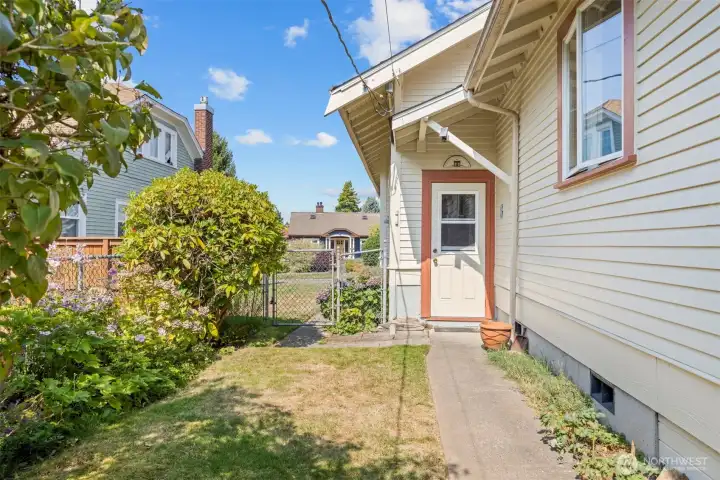 Looking at the back door off the stairway to the basement. The rear yard is fully fenced.