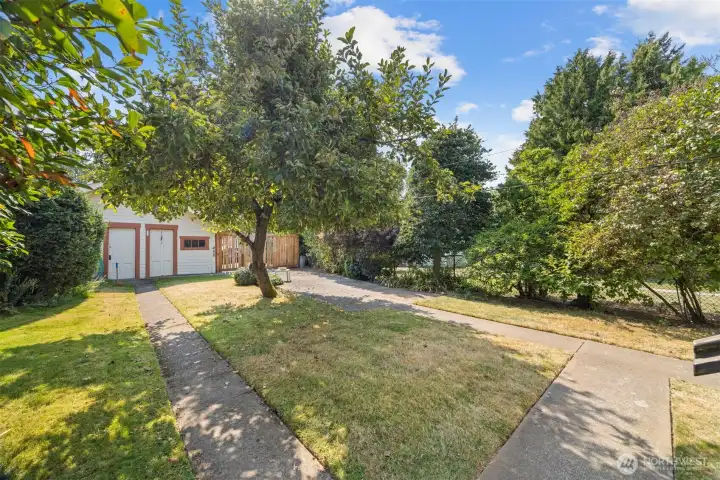 The rear yard is spacious and has a lovely 2 vehicle garage off the alley.