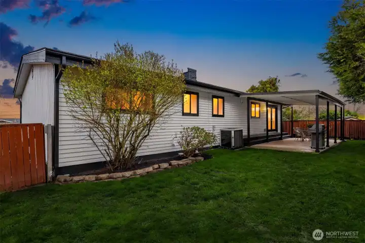 Private fenced yard in back with covered patio for year round enjoyment
