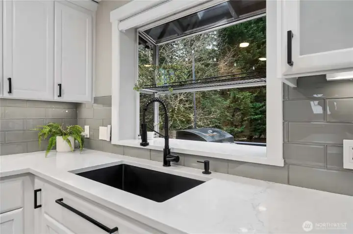 Garden window offers great light for growing plants and herbs.