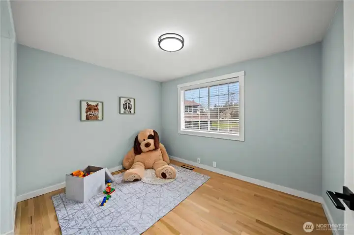 3rd bedroom with solid oak hardwood floors and custom closet.