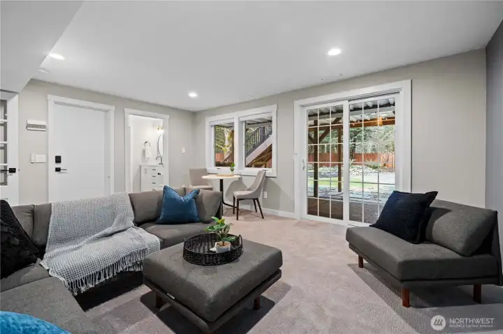 Two windows added to downstairs bonus room to enhance lighting. Bonus room slider opens to a fully covered patio.