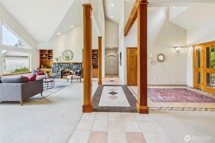 The view from the living/dining room areas down the hall to the main floor bedrooms and den/office.