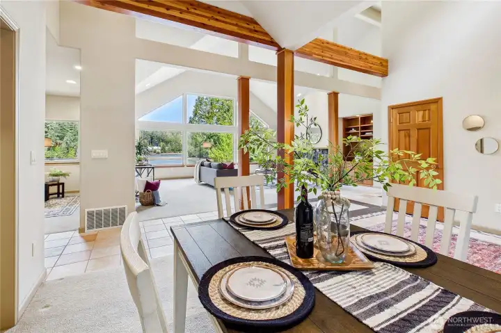 The dining room adjacent to both the kitchen and living room shares the exceptional daylight and views.