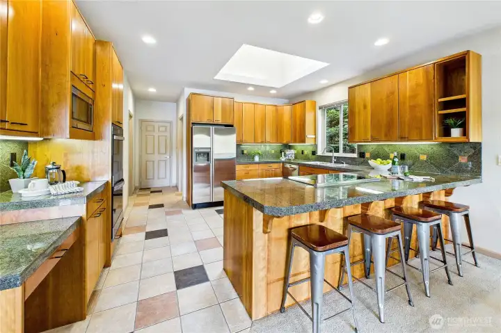 The large kitchen also features new double ovens and plenty of room to pull up a stool and visit.