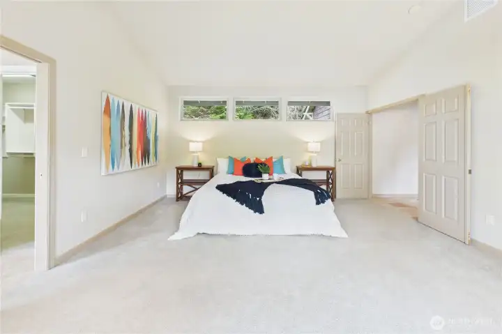 Bright and light filled, there is room for all your needs in the main-floor primary bedroom.