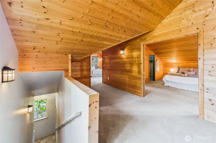At the top of the stairs above the garage is additional space for use as bedrooms or playrooms or whatever you choose! There is a full Jack-and-Jill bathroom between the two spaces. Multi-generational living, perhaps?