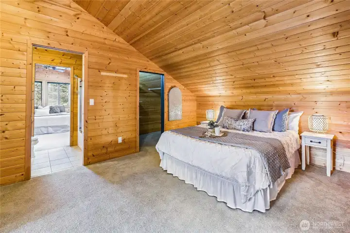 A view from the first bedroom through the bathroom to bedroom #2 over the garage.