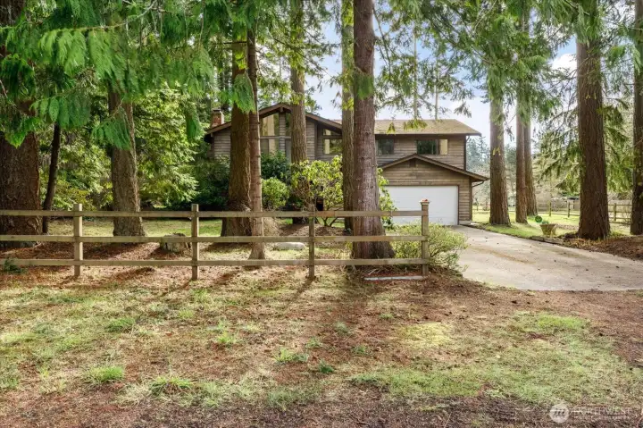 Welcome to 2011 Pine Wood Way, a welcoming wooded retreat waiting for your vision and special touch.