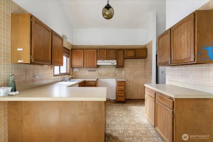 Spacious kitchen that could be remodeled to suit your needs.