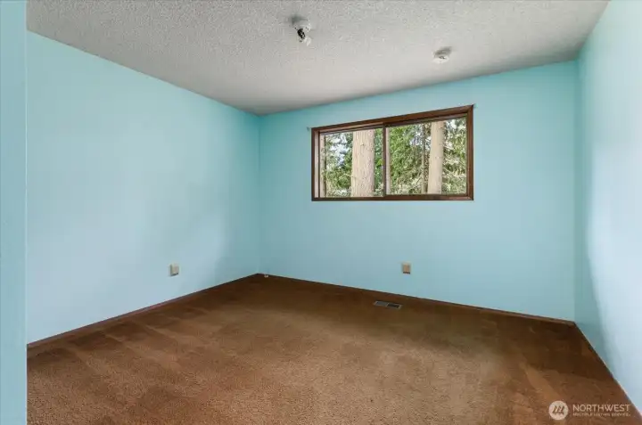 Bedroom across from the primary bedroom