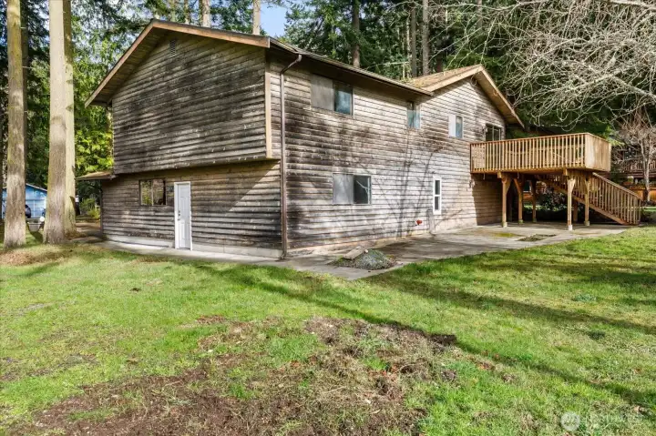 Love the big back yard, patio and deck! A little stain and this siding will look like new!