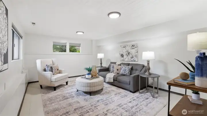 Flexible lower-level living area for media, games, or gatherings.