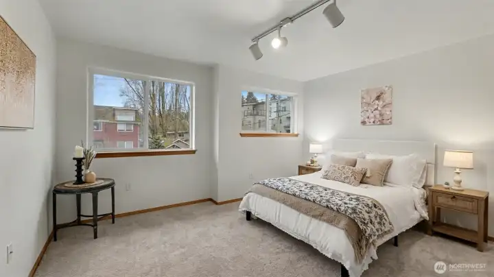 Bright and serene, this primary bedroom offers the perfect place to relax and recharge.