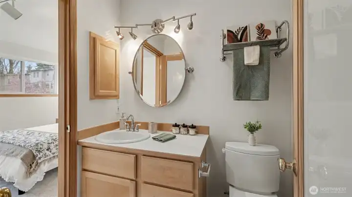 Fresh and bright ensuite with a spacious vanity and clean, classic finishes.